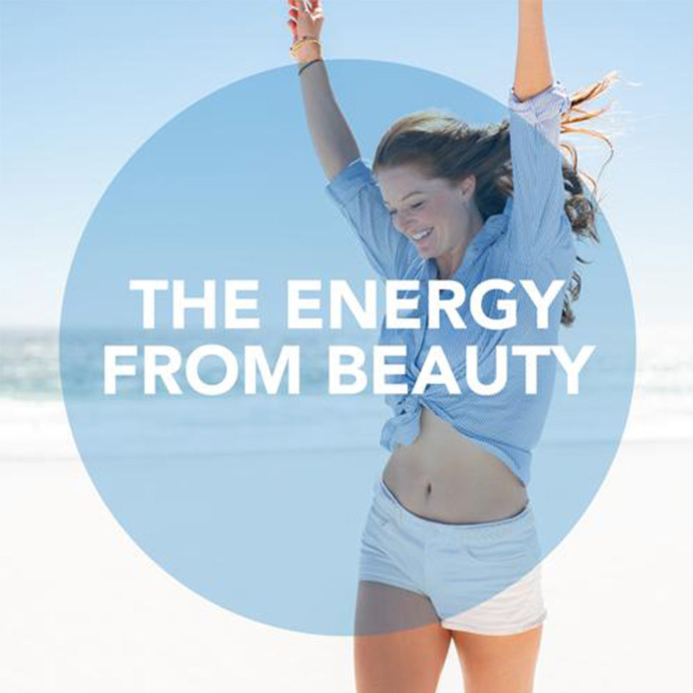 How to generate consistent energy. How energy and beauty relate? Young girl on the beach smiling with energy
