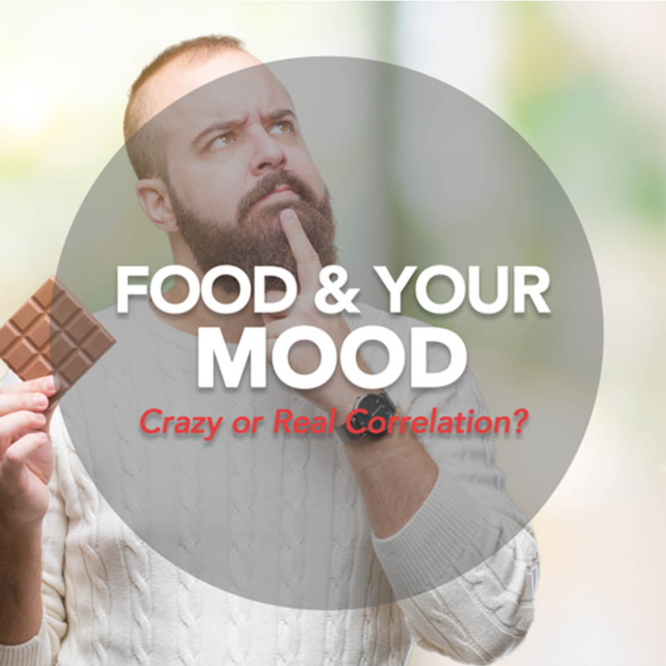 how food affects your mood. man holding chocolate bar while pondering if its worth eating